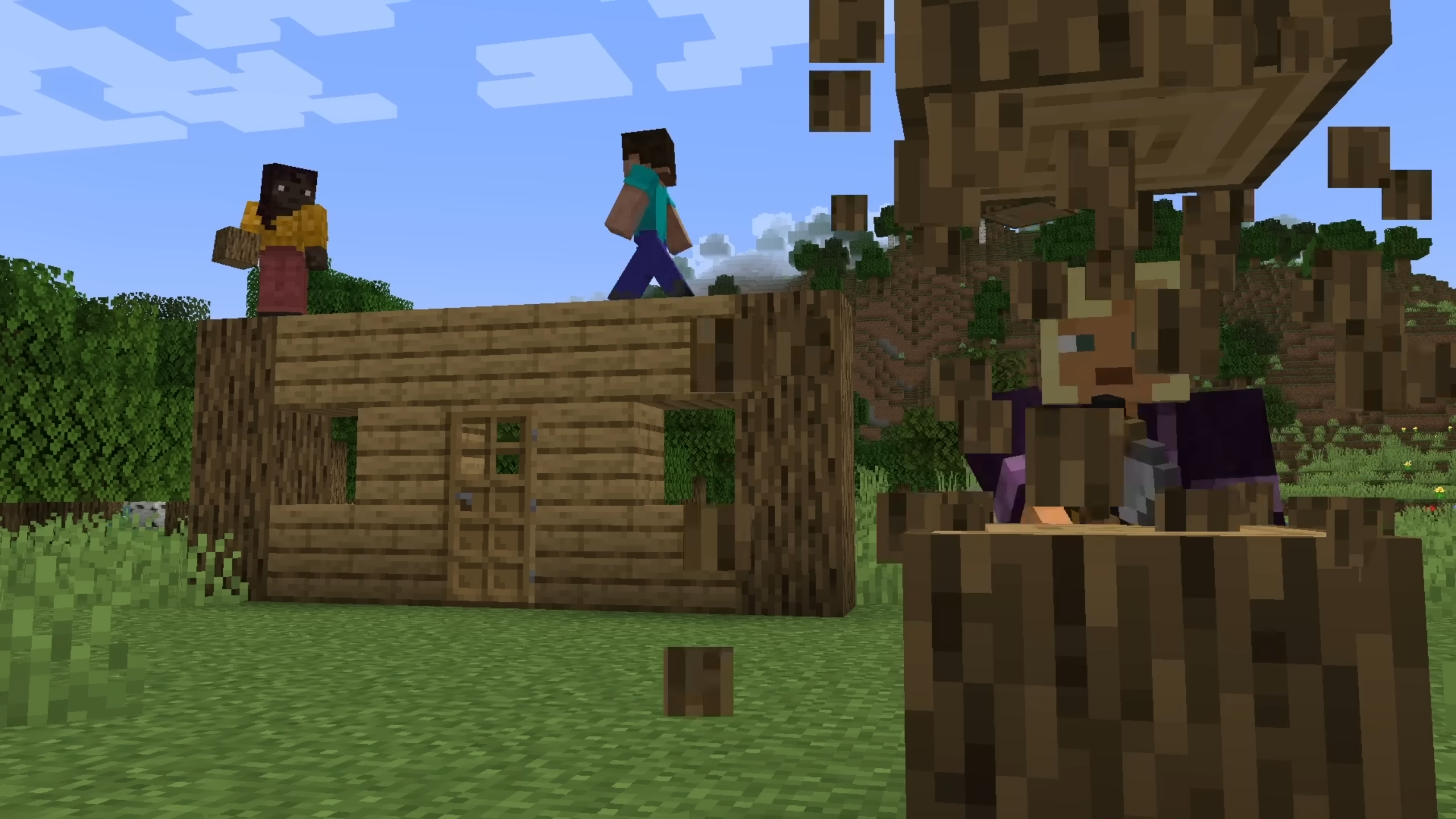 Kai chops while Makena builds in Minecraft